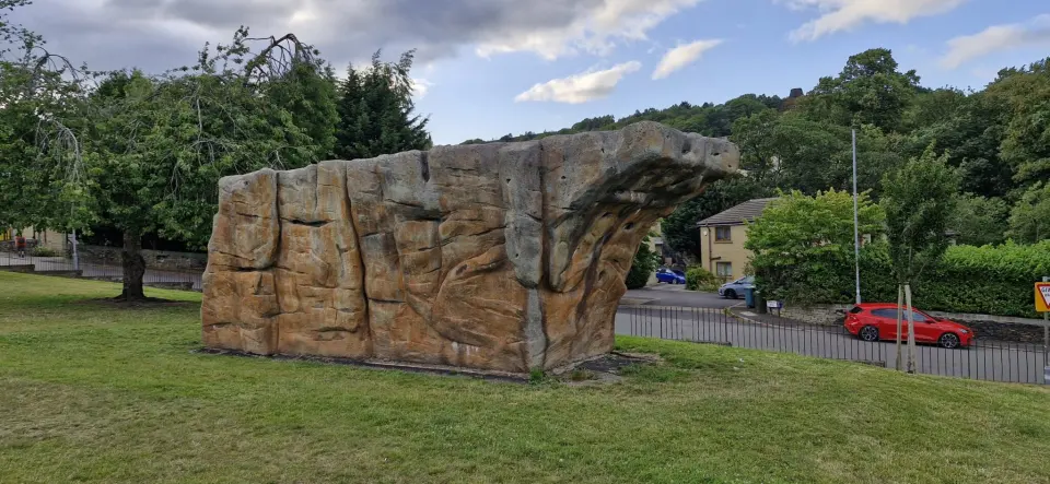 Long side of the boulder with its overhanging top edge