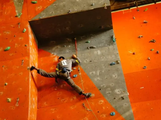 Climber on the orange and grey roped wall at Varna Climbing