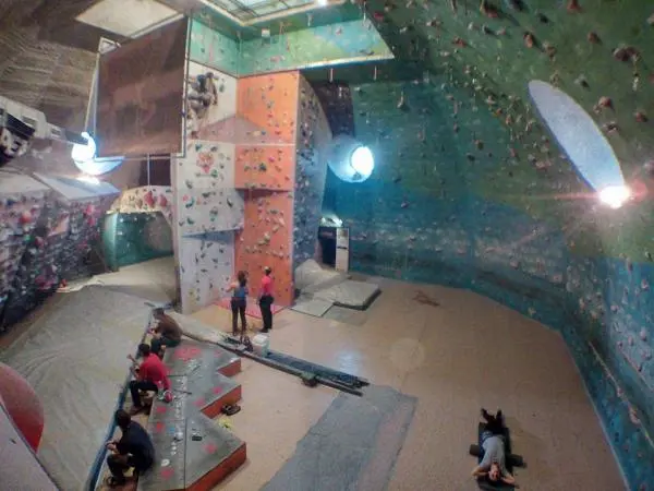 Roped climbing walls and matting beneath Sofia University's dome