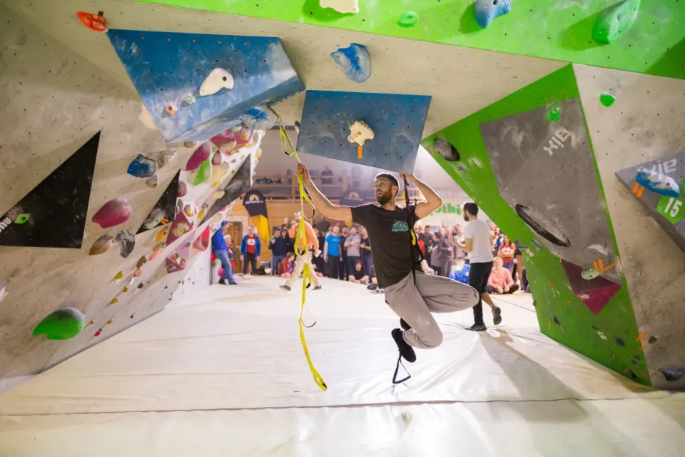 Climber beneath the overhanging bouldering walls at Fothia Velesajam