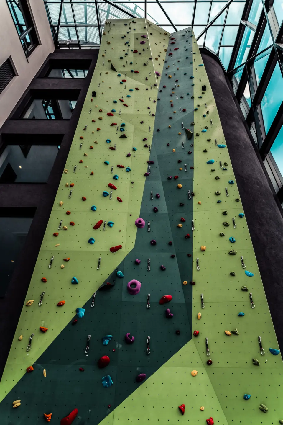 Roped climbing lines running up the Vema tower
