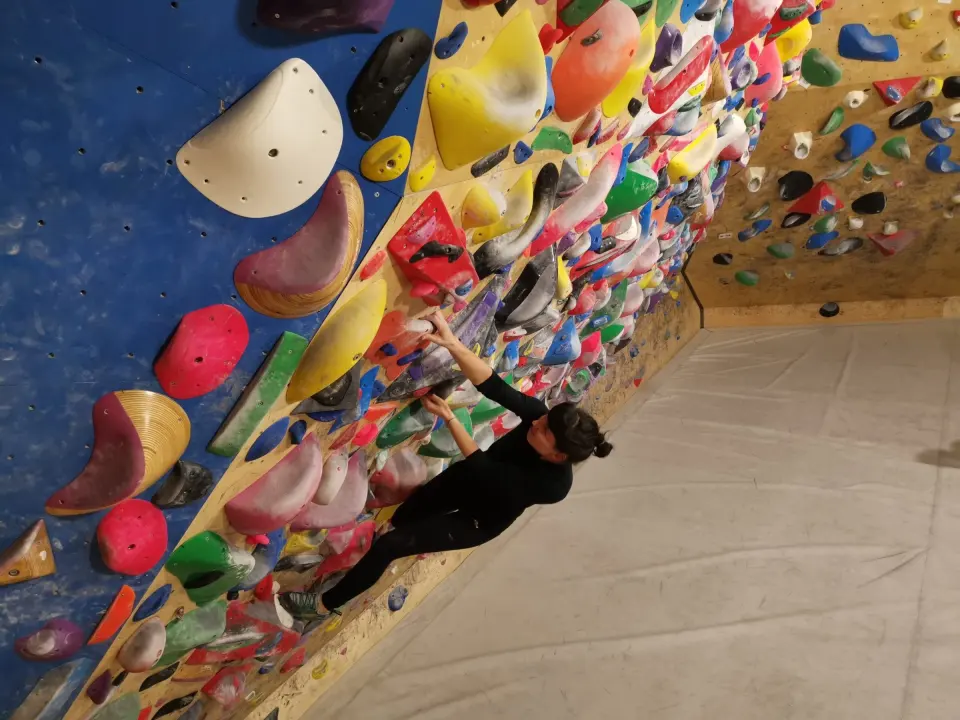 Climber on TNT’s densely set spray wall