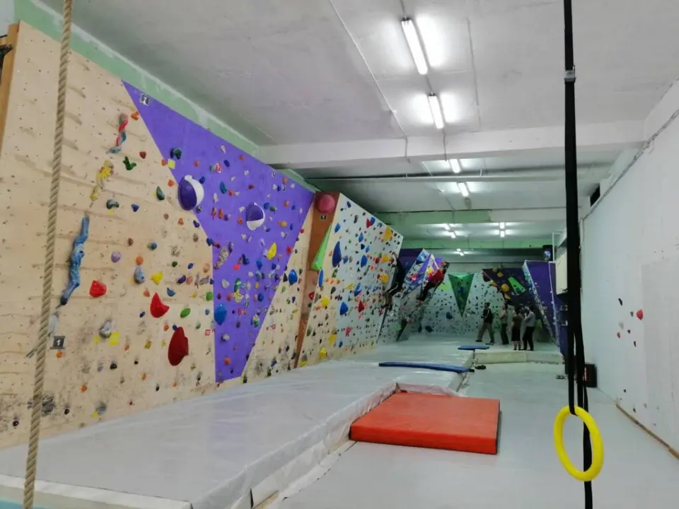 The length of Lapis’s bouldering room with coloured wall panels