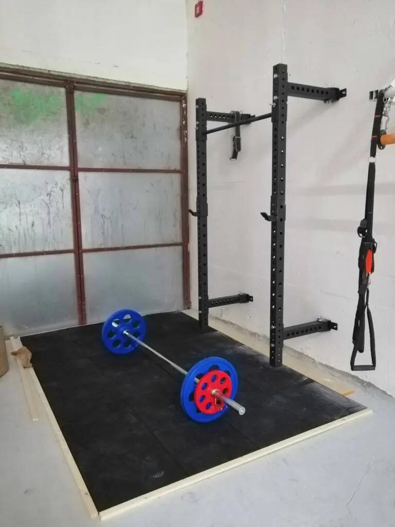 Pull-up bars and weights in Lapis’s training area