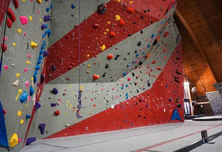 Red and grey striped lead walls with ropes hanging