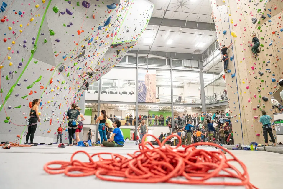 The roped hall with tall lead walls and a climbing tower