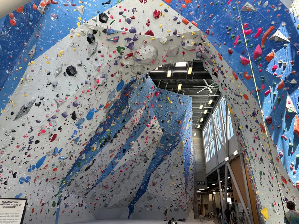 Blue and grey lead walls rising around the 40-foot arch, with tall windows behind