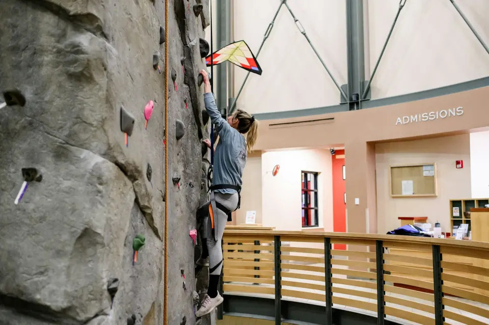 Climber on a top rope on the rock-style pinnacle in the centre's rotunda