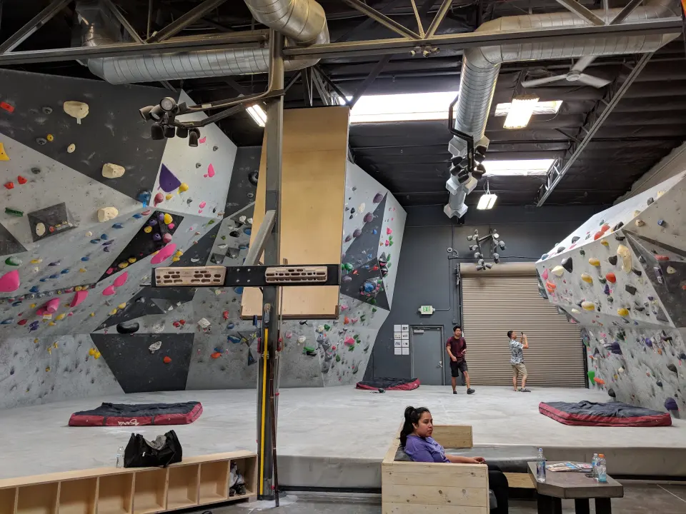 Main bouldering wall with the hanging campus board in front