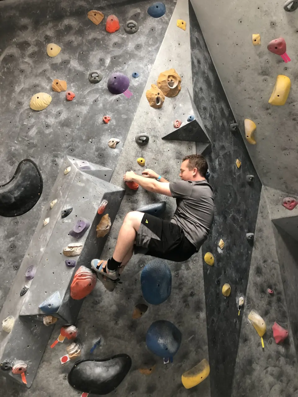 Climber on a steep corner with large holds