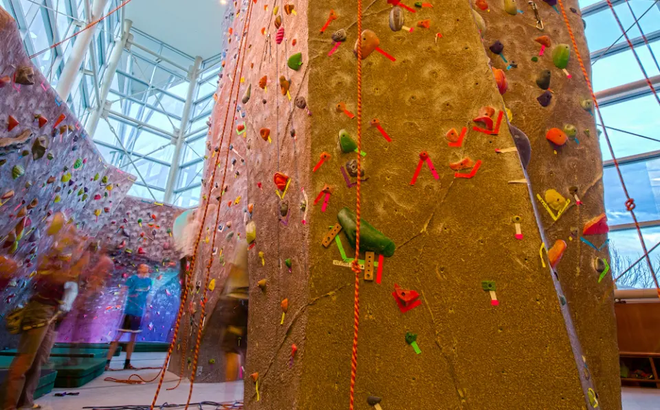 Roped climbing towers under the glass atrium of the Student Recreation Center