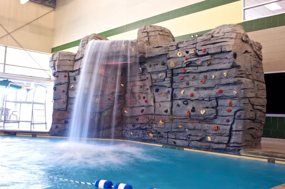Rock-style climbing wall and waterfall above the pool