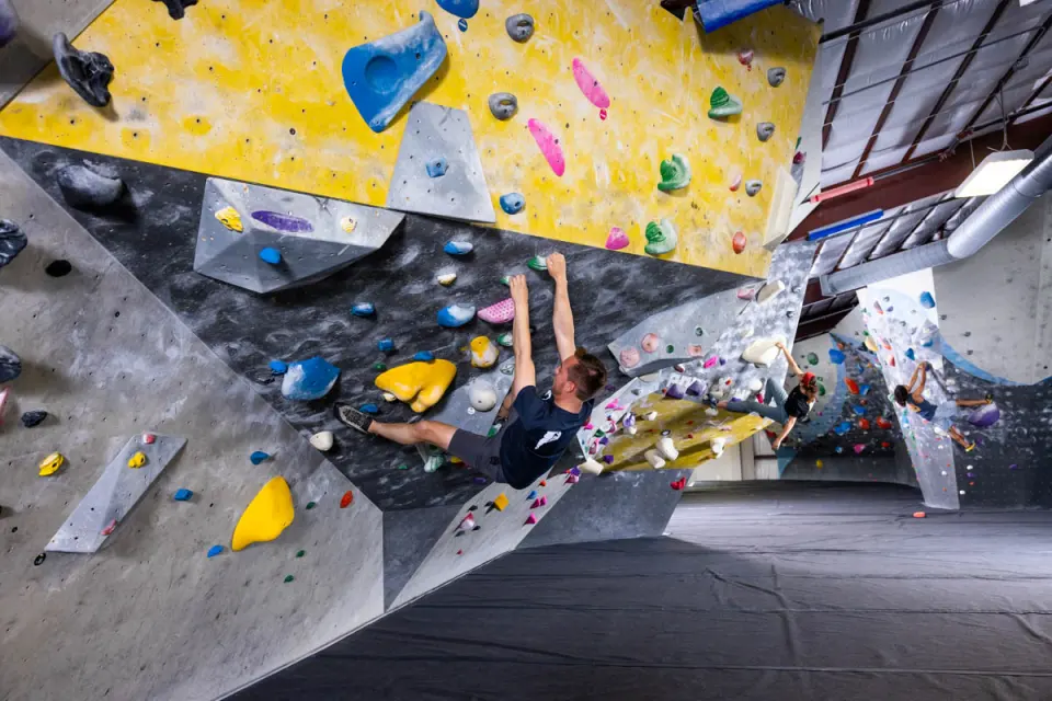 Bouldering under a yellow roof in the Barn