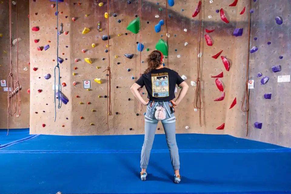 Climber studying a roped wall before a climb