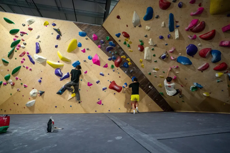 Climbers on the wooden bouldering walls