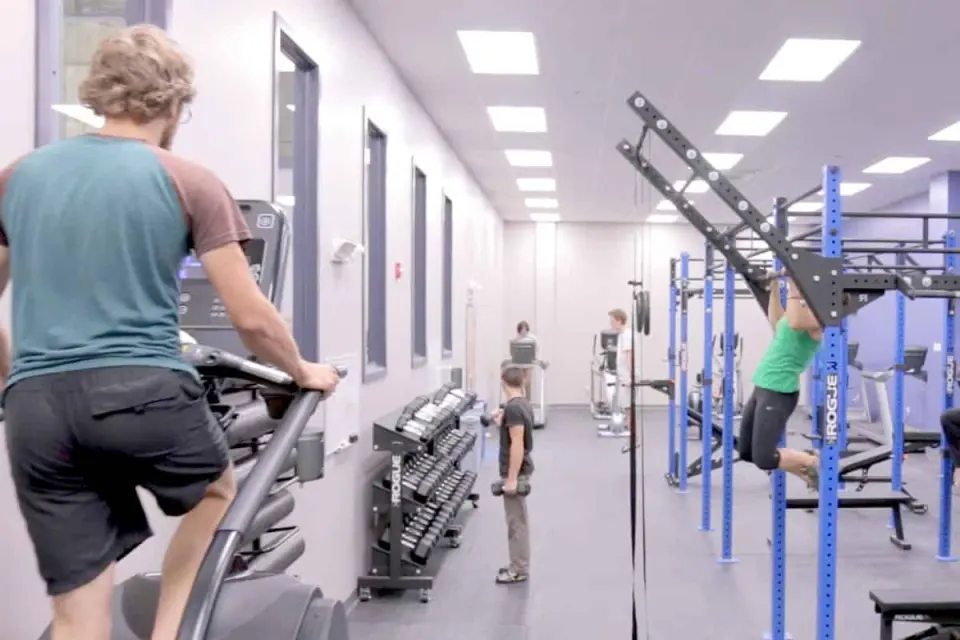 Fitness room with treadmills, dumbbells and a pull-up rig