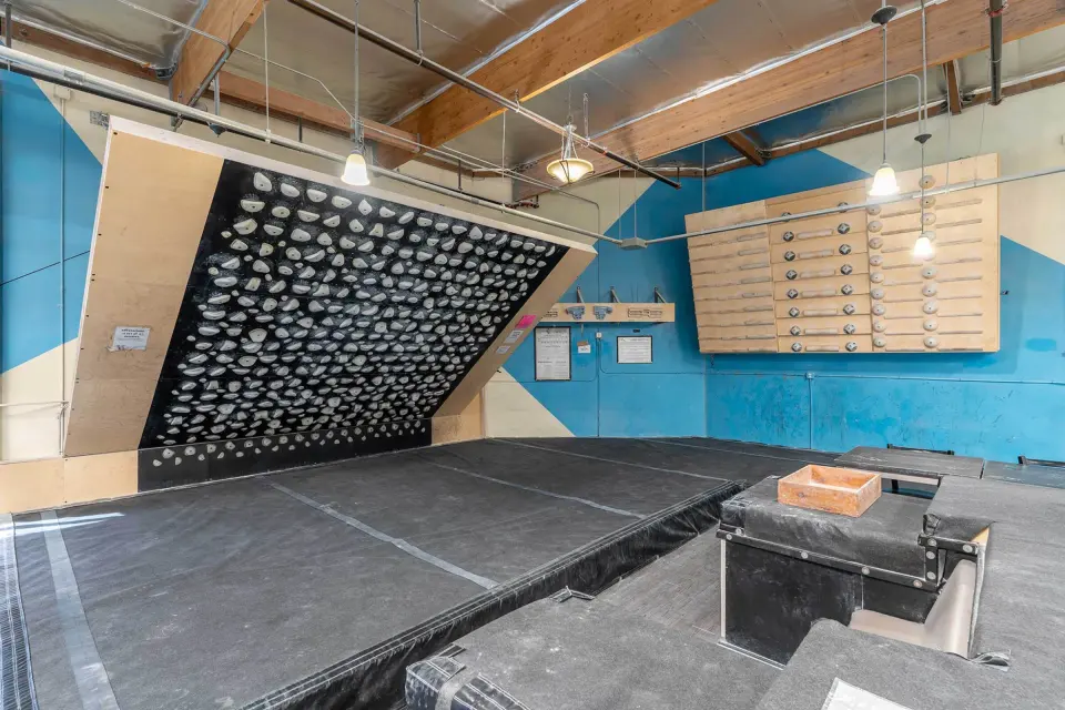 Kilter Board above the training-area matting