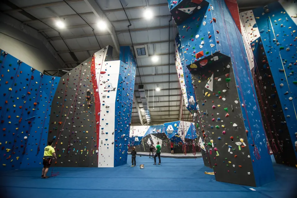 Tall blue, white and grey roped walls and towers across the main floor