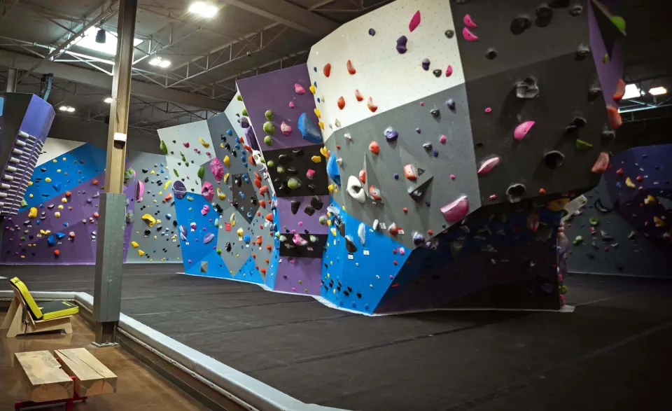 Freestanding grey and purple boulder with overhanging sides