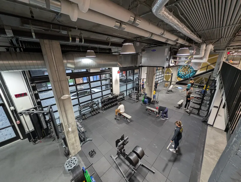 Weights area with racks, benches and machines seen from above