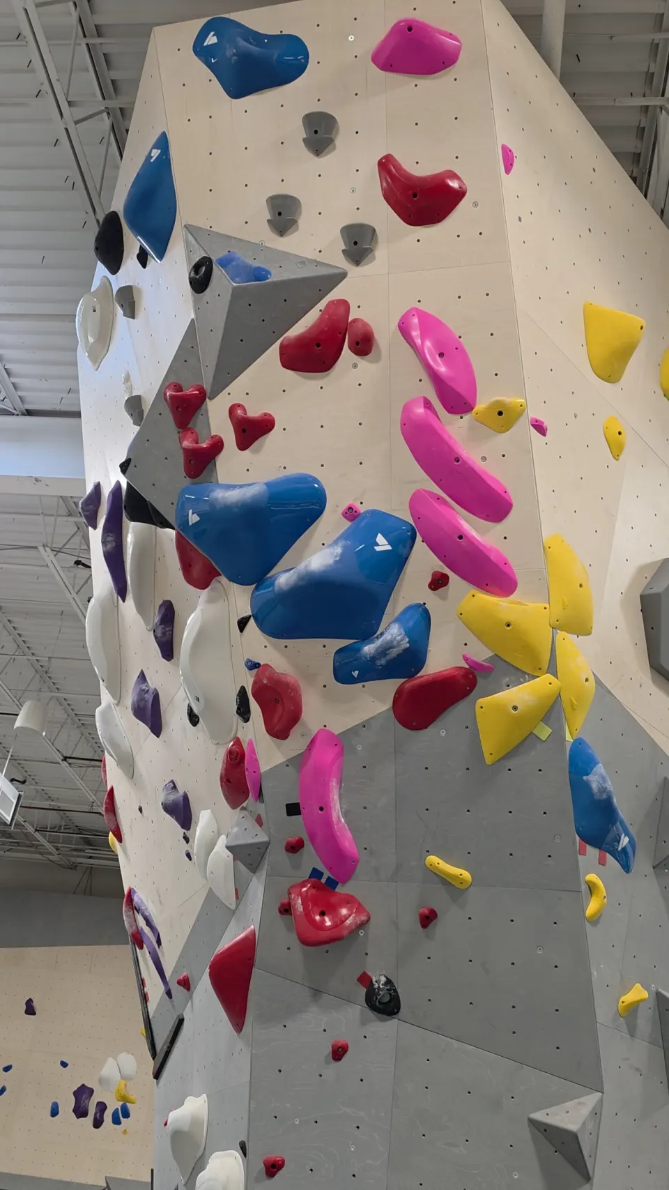 Holds set up an arete on the bouldering wall