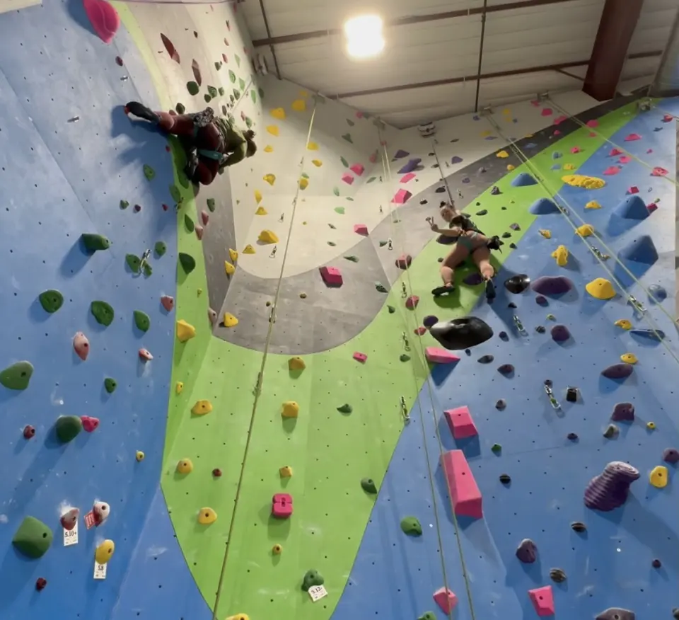 Corner of the roped walls with a bouldering block below