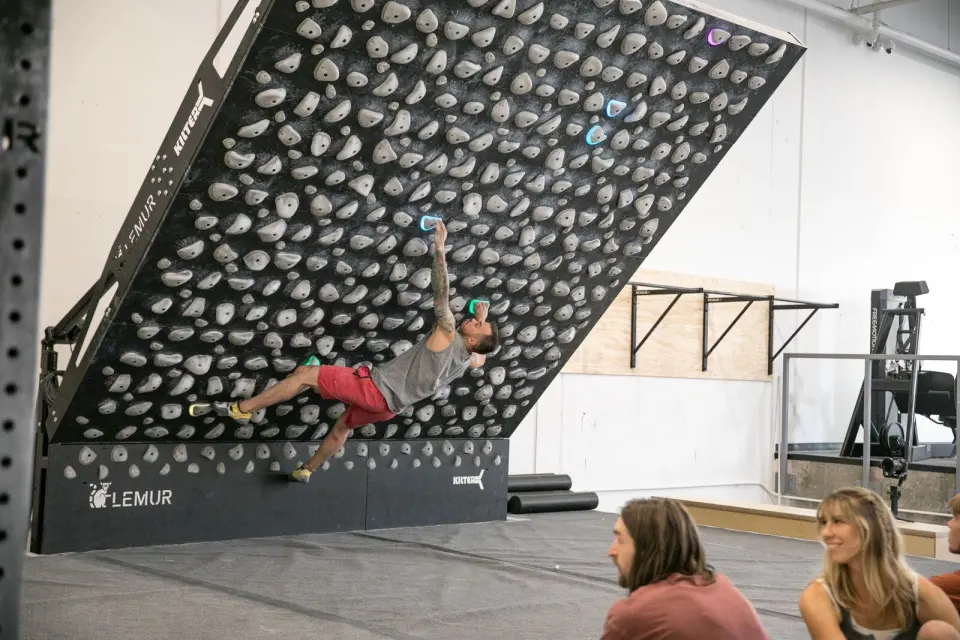 Climber on an LED system board in the training area