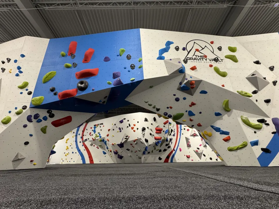 Bouldering wall and arch with The Gravity Vault logo