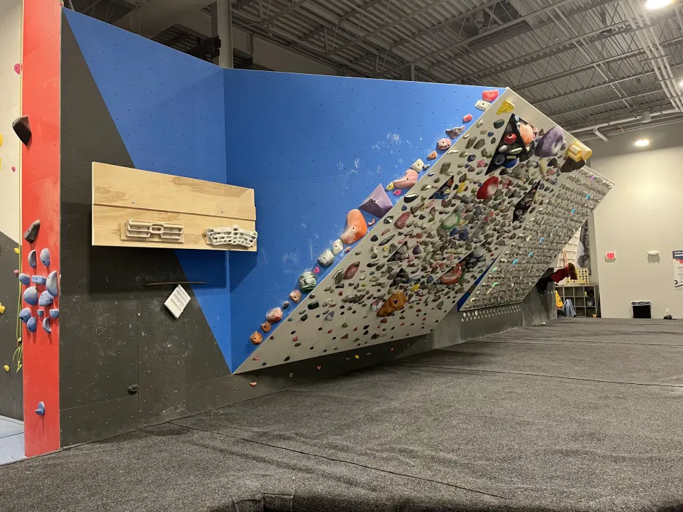 Adjustable Kilter Board with hangboards beside it