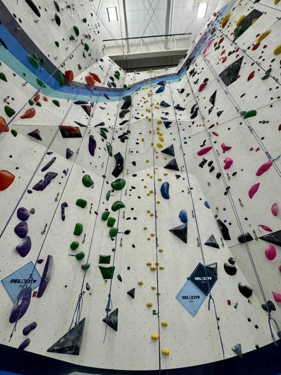 Tall top-rope wall carrying the Velocity logo