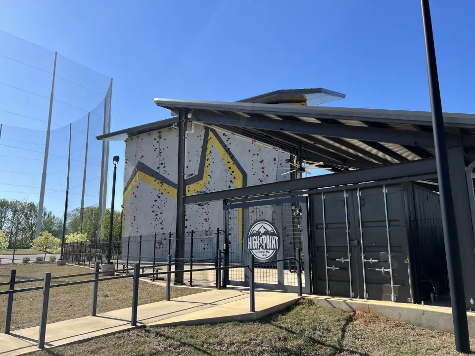 The outdoor climbing tower beside the gym