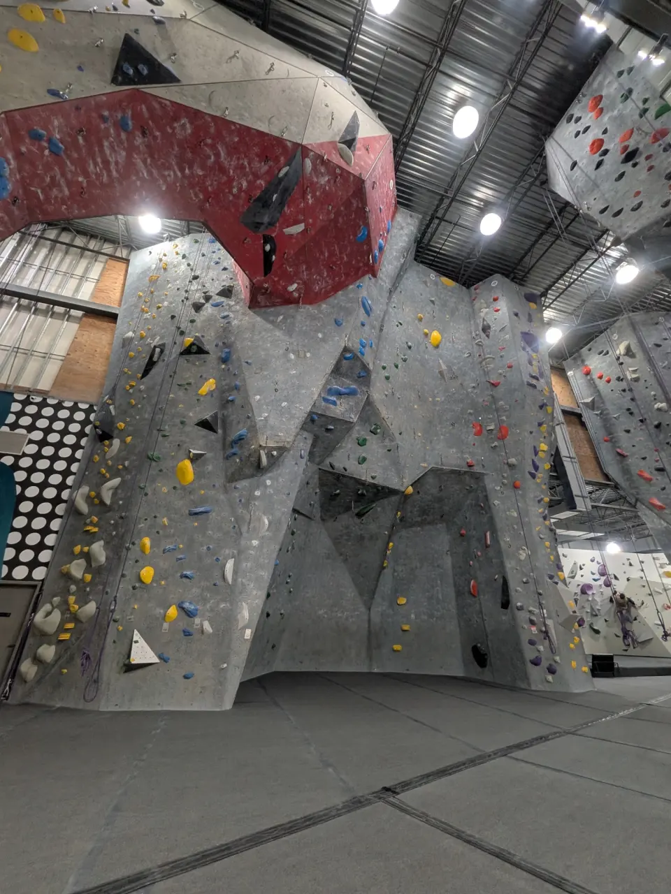 Grey walls below a red overhanging prow