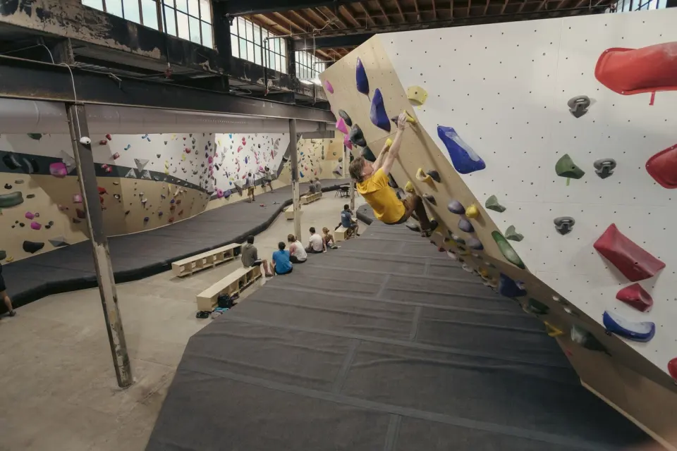 Bouldering walls and matting under the old mill windows