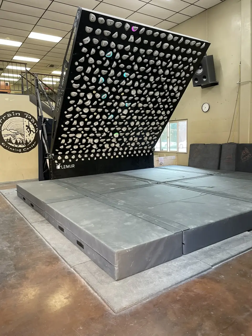 Kilter Board above its padded platform