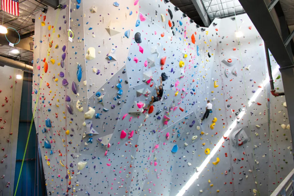 Climbers on the tall roped walls