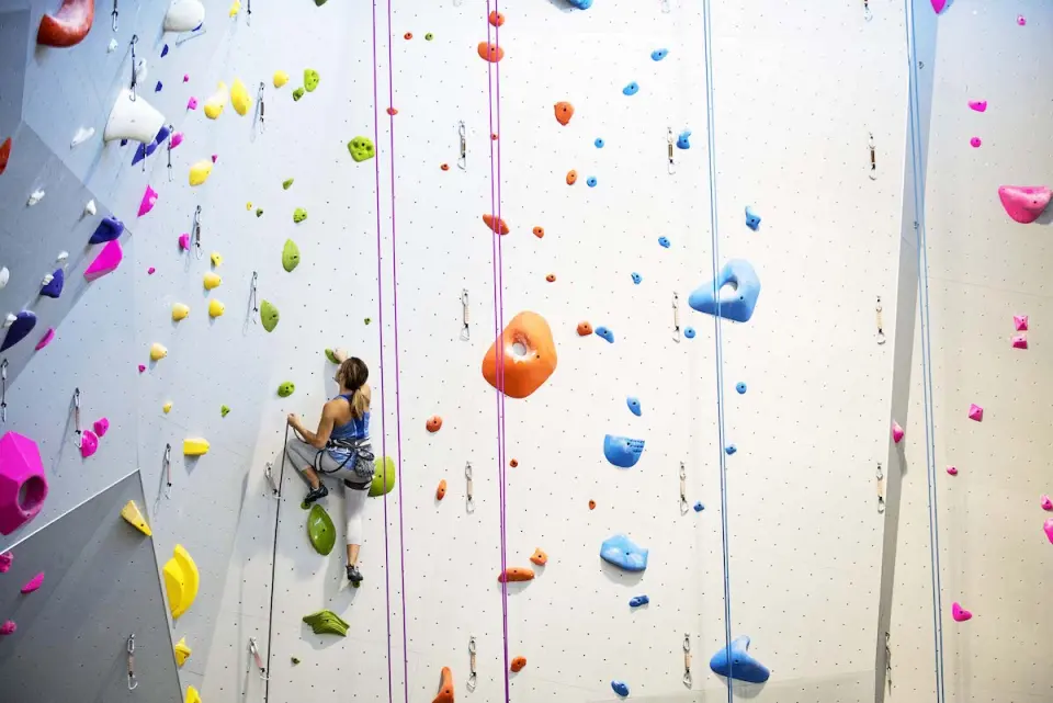 Lead climber high on a tall wall