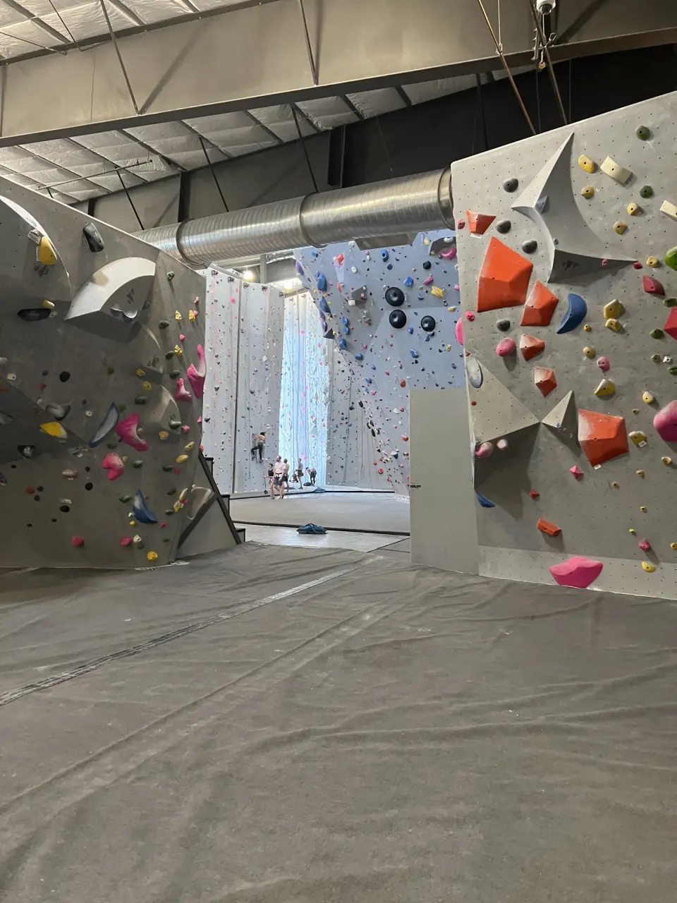 Bouldering wall with large orange volumes