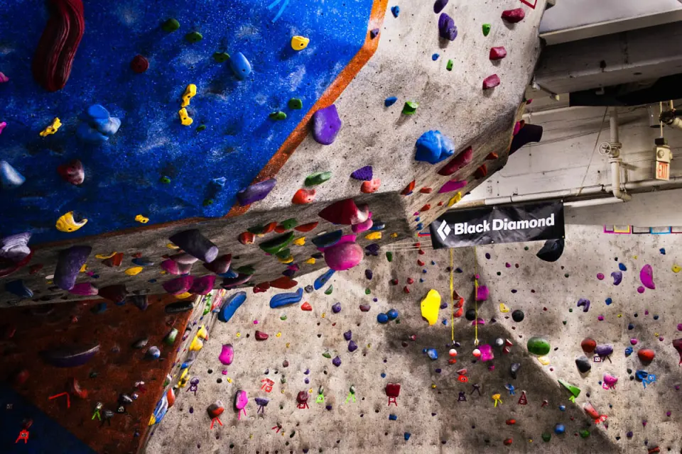Overhanging bouldering wall under the Black Diamond banner