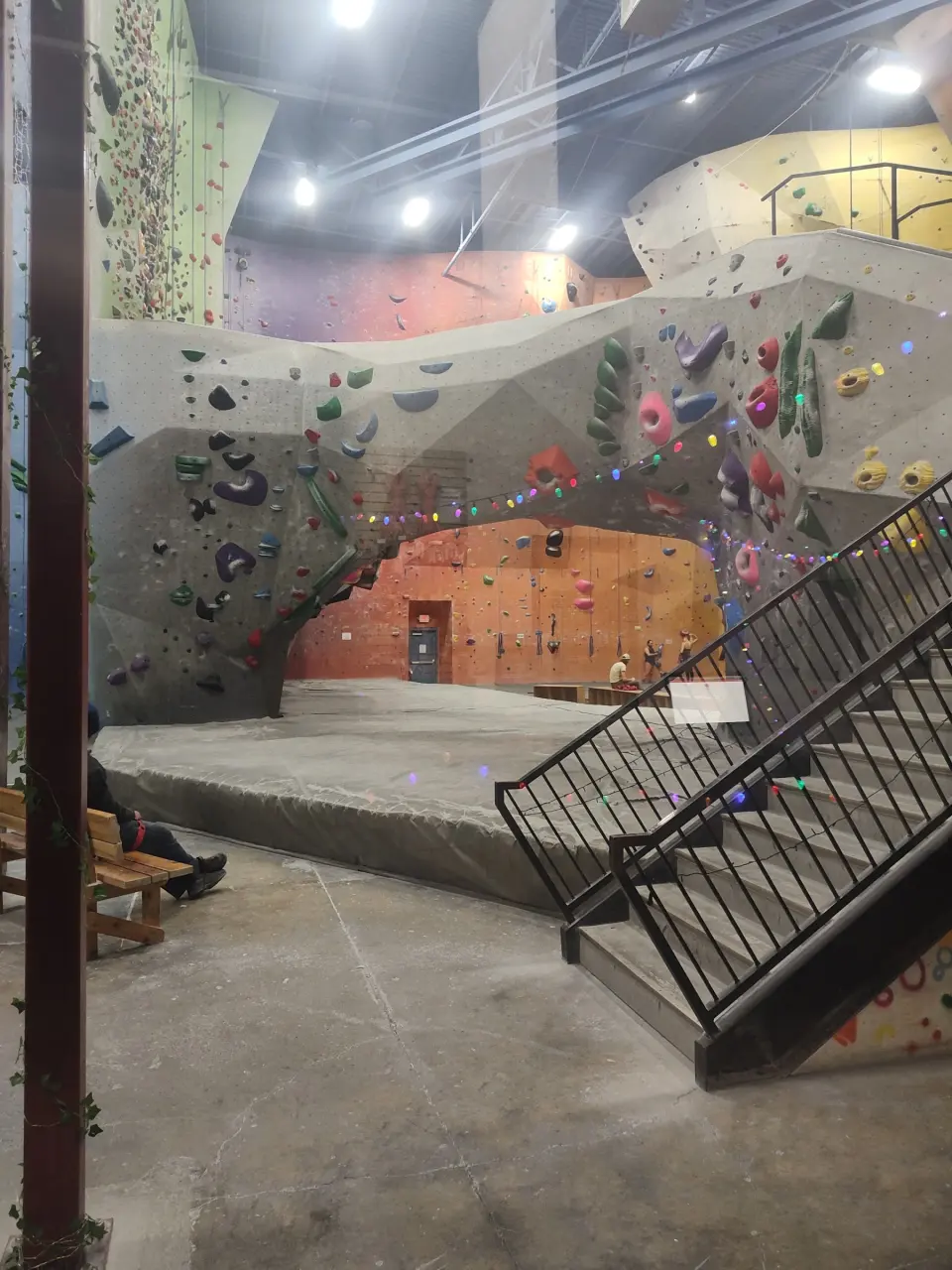 Bouldering walls beneath the mezzanine stairs