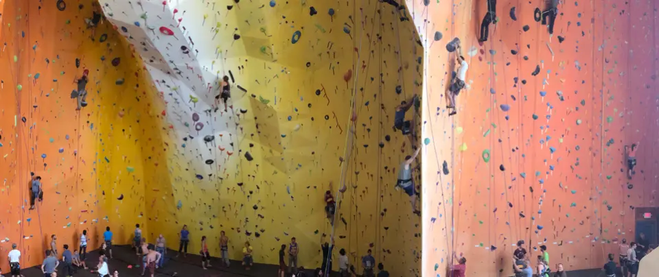 Climbers on the yellow and orange roped walls