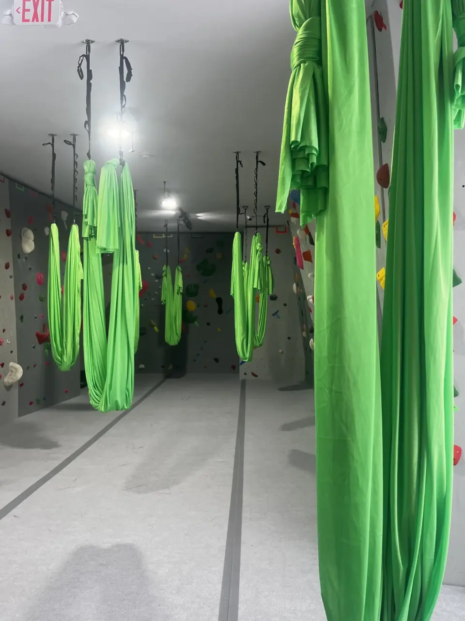 Aerial fitness silks hanging in the gym