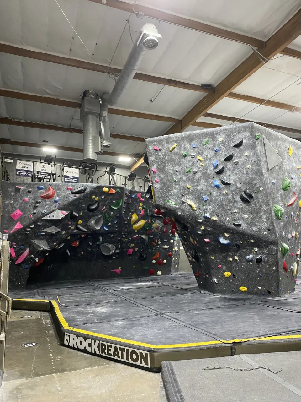 Two bouldering blocks above the padded floor