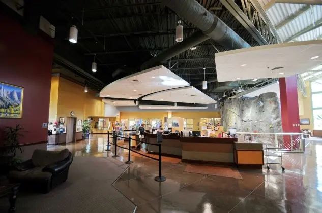 Community Center lobby with the faux-rock climbing wall behind the front desk
