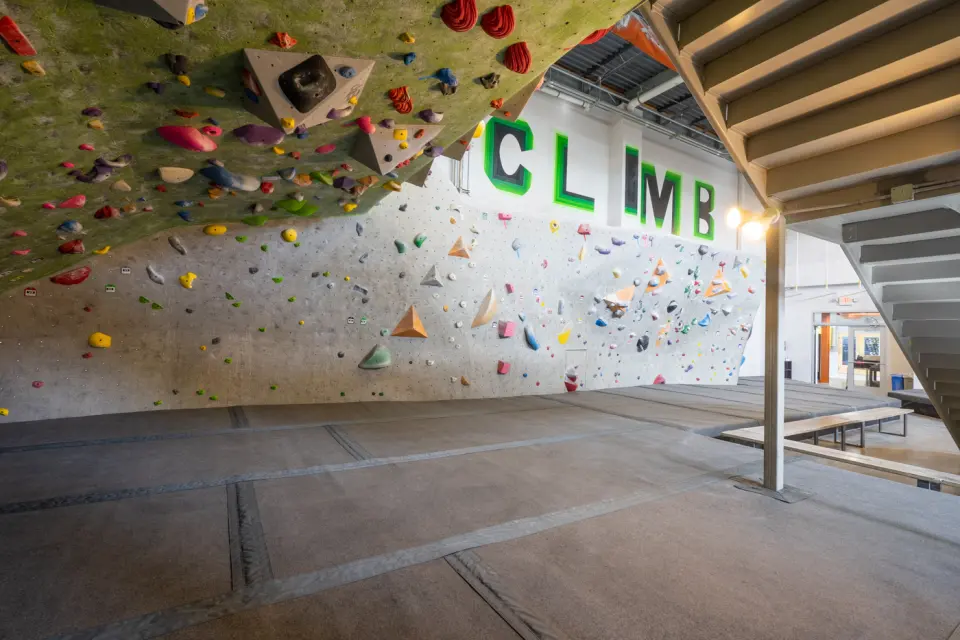 Bouldering walls beneath the big CLIMB lettering