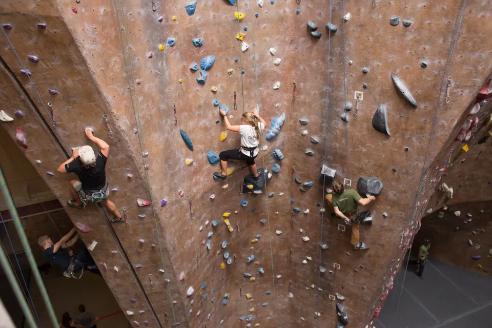 Climbers on a tall wall with arêtes