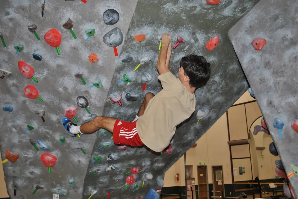 Bouldering on the overhanging section of the wall