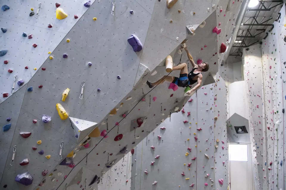 Climber on an arête of the tall walls