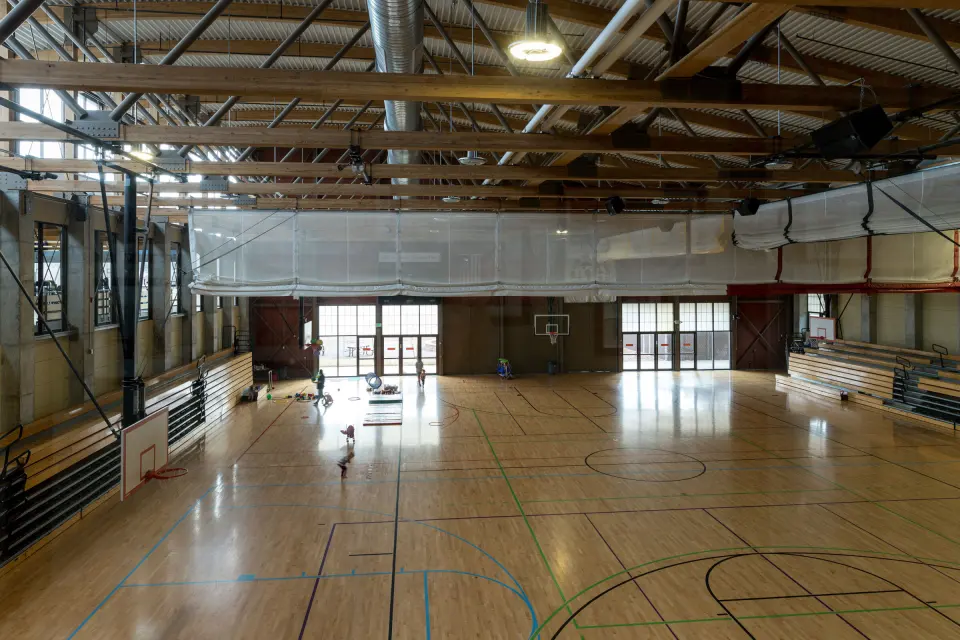 The gymnasium, whose west side holds the climbing wall