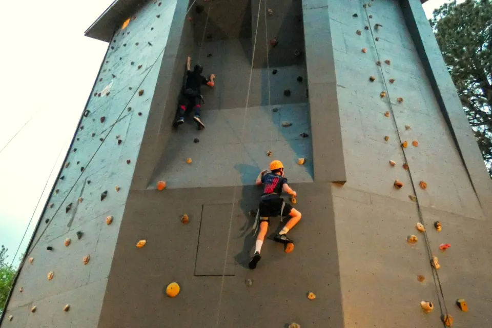 Two climbers on the six-sided outdoor climbing tower