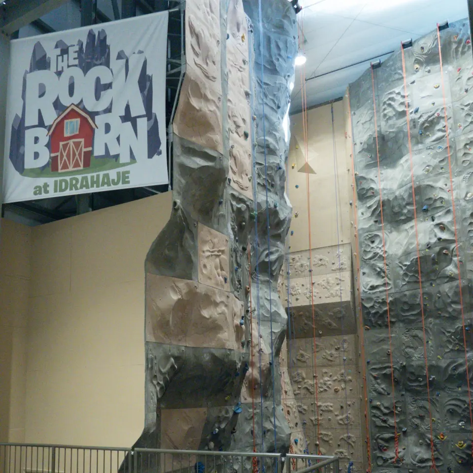 Tall roped walls and sign inside the Rock Barn